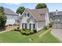 Charming two-story home with landscaped yard and manicured lawn in a suburban neighborhood at 1472 Lynchburg Pl, Marietta, GA 30062