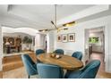 Bright dining room featuring stylish lighting, and an elegant oval table with seating for six at 1701 Clay Brooke Se Ct, Smyrna, GA 30082