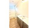 Clean bathroom featuring a tub-shower combo, gray vanity with modern countertops at 3106 Zodiac Ct, Lawrenceville, GA 30044