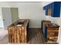 Renovated kitchen showcases a butcher block island and sleek cabinetry at 451 Collier Ridge Nw Dr, Atlanta, GA 30318