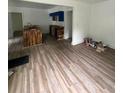 Open-concept living area features beautiful new wood-look floors throughout the home at 451 Collier Ridge Nw Dr, Atlanta, GA 30318