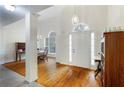 Spacious foyer with hardwood floors and decorative lighting at 733 Exchange Mill Pl, Dacula, GA 30019