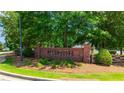 Community entrance sign for River Oaks Plantation, surrounded by landscaping at 733 Exchange Mill Pl, Dacula, GA 30019