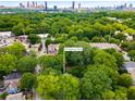 Aerial view of the property site nestled among mature trees in a residential neighborhood at 1200 Mansfield Ne Ave, Atlanta, GA 30307
