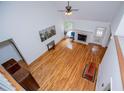 Hardwood-floored living room with high ceiling, fireplace, and view from upstairs at 7392 N Mitchell N Ct, Villa Rica, GA 30180