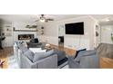 Inviting living room featuring hardwood floors, a fireplace, and ample seating at 573 Hastings Way, Jonesboro, GA 30238