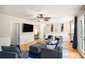 Relaxing living room with a neutral color palette, hardwood floors, and modern decor at 573 Hastings Way, Jonesboro, GA 30238