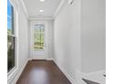 Bright foyer with hardwood floors and a view of the front door at 1858 Glenview Park Cir, Duluth, GA 30097
