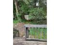 Backyard view from upper deck featuring a wooden shed and tiered levels at 4059 Heritage Valley Ct, Norcross, GA 30093