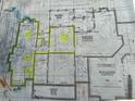 Detailed floor plan showcasing the home's layout, including the basement and garage, with notes and highlighted areas at 410 Iroquois Ct, Covington, GA 30014