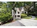 Lovely painted-brick home with well-kept landscaping and a two-car garage on a sunny day at 1833 N Rock Springs Ne Rd, Atlanta, GA 30324