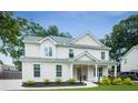 Charming two-story home with a manicured lawn and inviting front porch at 2486 Eastwood Dr, Atlanta, GA 30032