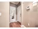 Condo entryway featuring hardwood floors, neutral walls, and entry to additional room at 3777 Peachtree Ne Rd # 438, Brookhaven, GA 30319