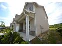 Charming two-story home with a well-manicured lawn and large gutters at 7753 Hansel Ln, Lithonia, GA 30058