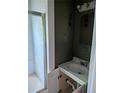 Bathroom with vanity sink, white cabinets, and shower with glass doors at 1750 Beechwood Sw Blvd, Atlanta, GA 30311