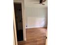 Clean bedroom showcasing hardwood floors, a ceiling fan, and an adjoining bathroom at 2037 Brannen Se Rd, Atlanta, GA 30316
