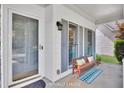 Inviting front porch featuring a cozy bench, decorative pillows, and a stylish rug at 4206 Moccasin Trl, Woodstock, GA 30189
