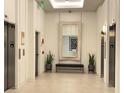 Elegant lobby area with neutral tones, seating, and accent mirror decor at 788 W Marietta Nw St # 512, Atlanta, GA 30318