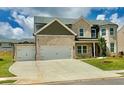 Beautiful two-story brick home with a spacious driveway and well-maintained lawn at 118 Longhorn Way, Auburn, GA 30011