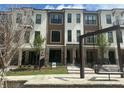 Modern three-story townhome with attractive architectural details and inviting outdoor space at 358 Olmstead Way # 25, Alpharetta, GA 30022