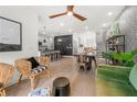 Cozy living room featuring stylish decor, hardwood floors, and an open floor plan connected to the dining area at 383 Pratt Drive #506 Dr, Atlanta, GA 30315