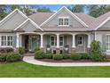 Inviting front porch with rocking chairs and elegant landscaping at 208 Wilshire Ter, White, GA 30184