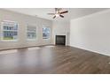 Bright living room with fireplace, hardwood floors, and ample natural light at 36 Crescent, Dallas, GA 30157
