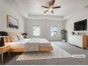 Spacious main bedroom with tray ceiling, soft carpet, and bright windows; virtually staged at 36 Crescent, Dallas, GA 30157