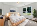 Cozy main bedroom with modern decor, natural light, and ample space for relaxation at 256 Prometheous Way, Rockmart, GA 30153