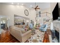 Spacious living room with high ceilings, a fireplace, hardwood floors, and plenty of natural light at 2610 Links End, Roswell, GA 30076
