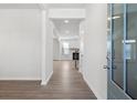 Bright entryway features wood floors, neutral walls, and view to living room at 4778 Moonstone Trce, Kennesaw, GA 30144