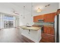 Bright kitchen featuring granite countertops, stainless steel appliances, and a large island at 711 Cosmopolitan Ne Dr # 802, Atlanta, GA 30324