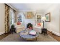 Cozy living area with decorative fireplace, inviting armchairs and hardwood floors at 2811 Alpine Ne Rd, Atlanta, GA 30305