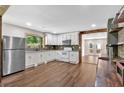 Bright kitchen featuring stainless steel appliances, granite counters, and modern cabinets at 161 Old Vandiver Dr, Canton, GA 30114