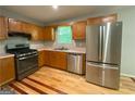 Well-appointed kitchen featuring stainless steel appliances and ample cabinet space, ready for culinary adventures at 48 Glenhaven Ct, Douglasville, GA 30134