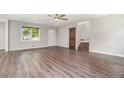 This living room features fresh paint, wood flooring, and ample natural light at 2067 Skyhawk Ln, Acworth, GA 30102