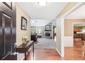 Inviting entryway features hardwood floors, leading to a living area with a stone fireplace at 2118 Braswell Ln, Loganville, GA 30052