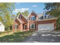 Beautiful red brick home with manicured lawn, and a two car garage at 2335 Corbett Ct, Powder Springs, GA 30127