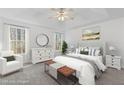 Spacious main bedroom boasts natural light, tray ceilings, and neutral palette, a true retreat at 305 Bridgewater Ter, Canton, GA 30115