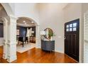Elegant foyer with hardwood floors and classic trim, with entry to formal dining at 4645 Wykeshire Ct, Cumming, GA 30041