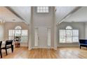 Bright foyer with gleaming hardwood floors, high ceilings, and an abundance of natural light at 1868 Birch Briar Bnd, Lawrenceville, GA 30043