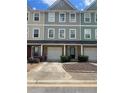 Charming townhome with a one car garage and a well maintained front yard at 6361 Redan Sq, Lithonia, GA 30058