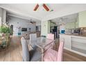 Open-concept dining area with views of the kitchen and living room, perfect for entertaining at 5016 Comanche Nw Ct, Lilburn, GA 30047