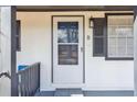 Close-up of the front door with painted doorframe, contrasting shutters, and freshly painted siding at 5119 Ne Worsham St, Covington, GA 30014