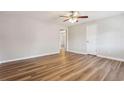 Bright living room featuring wood-look floors, a ceiling fan, and neutral paint at 5119 Ne Worsham St, Covington, GA 30014