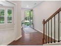Bright foyer featuring dark hardwood floors and sunlit rooms at 531 Headwind Way, Alpharetta, GA 30005