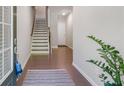 Inviting foyer with gleaming hardwood floors and a staircase at 531 Headwind Way, Alpharetta, GA 30005