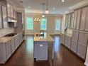 Spacious kitchen with granite countertops, an island, and stainless steel appliances at 531 Headwind Way, Alpharetta, GA 30005