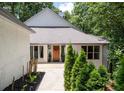 Charming home featuring manicured landscaping and walkway at 145 Mount Shasta Ln, Johns Creek, GA 30022