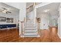 Spacious foyer with hardwood floors, a staircase with carpet runner, and views into adjacent living areas at 2009 Mclain Nw Rd, Acworth, GA 30101